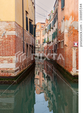 Venice. Old beautiful houses over the canal on a sunny day. 100895544