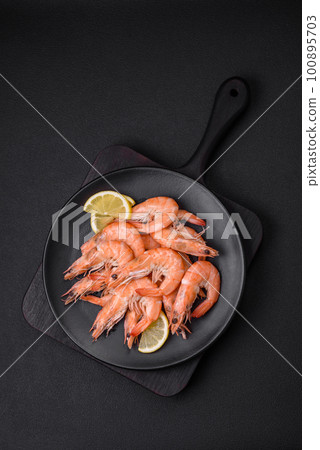 Tiger shrimp or langoustine boiled with spices and salt 100895703