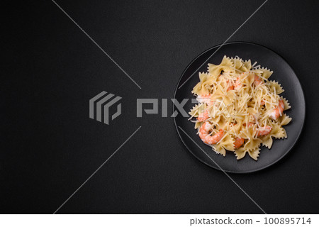 Delicious farfalle pasta with langoustine shrimp with creamy sauce Delicious farfalle pasta with langoustine shrimp with creamy sauce 100895714