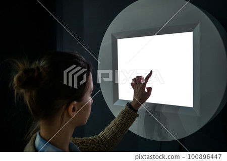 Woman touching white blank display of electronic kiosk - mockup image 100896447