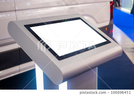 Electronic multimedia tablet kiosk with blank white display at exhibition 100896451
