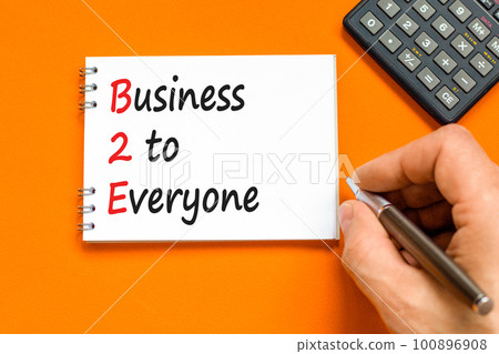 B2E business to everyone symbol. Concept words B2E business to everyone on white note on a beautiful orange table orange background. Business and B2E business to everyone concept. Copy space. B2E business to everyone symbol. Concept words B2E business to everyone on white note on a beautiful orange table orange background. Business and B2E business to everyone concept. Copy space. 100896908