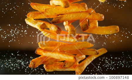 Freeze Motion Shot of Falling Fresh French Fries, Close-up 100897148