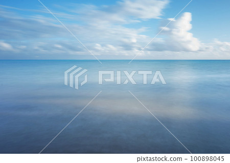 Blue smooth sea water with sky Blue smooth sea water with sky 100898045
