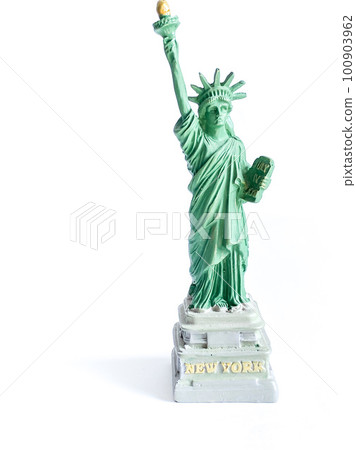 Small Liberty Statue souvenir on white background, a landmark of New York city 100903962