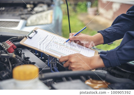 Mechanic car service auto garage in automotive mobile center. Technician workshop repair engine motor vehicles service mechanical engineering business. Automobile mechanic hands car repairs technic Mechanic car service auto garage in automotive mobile center. Technician workshop repair engine motor vehicles service mechanical engineering business. Automobile mechanic hands car repairs technic 100905392