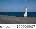 Seaside lighthouse and lone traveler 100906987