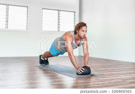 Home gym medicine ball workout abs exercise stability body exercises man training tricep pushups Home gym medicine ball workout abs exercise stability body exercises man training tricep pushups 100908565