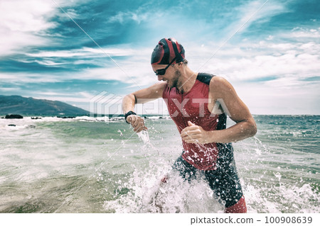 Runner man athlete checking smartwatch heart rate monitor during workout on wearable tech sports watch