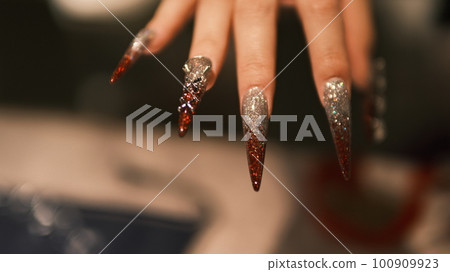 woman showing off her nails woman showing off her nails 100909923