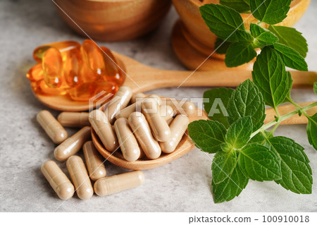 Alternative medicine herbal organic capsule with vitamin E omega 3 fish oil, mineral, drug with herbs leaf natural supplements for healthy good life. 100910018