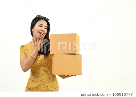 Cheerful asian woman with parcel cardboard boxes isolated white background. Online marketing and shipping service concept 100910777