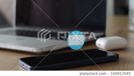 Smartphone on the table showing 3d mail icon graphic animation on the phone screen. 3d graphic animation,social media network. Smartphone on the table showing 3d mail icon graphic animation on the phone screen. 3d graphic animation,social media network. 100911045
