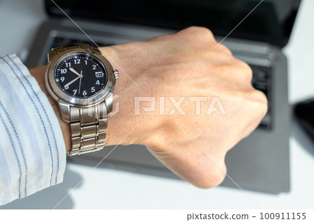 Check the time while working in the office Check the time while working in the office 100911155