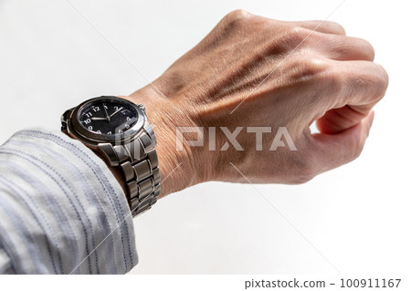 man's hand with wristwatch man's hand with wristwatch 100911167