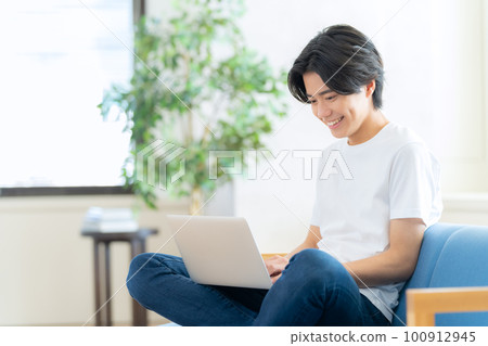 Male living room lifestyle living alone Male living room lifestyle living alone 100912945
