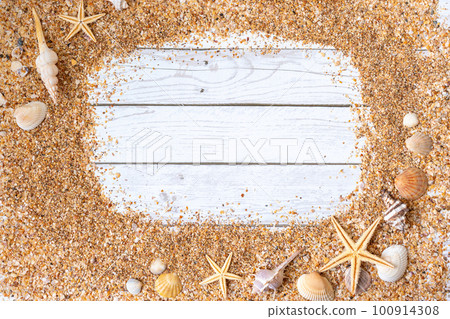 Sand seashells background. Summer time concept with sea shells and starfish on wooden background and sand 100914308
