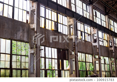The abandoned old factory building inside 100915783