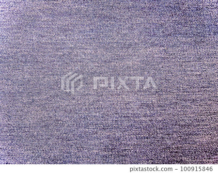 A background image of bright violet plain denim fabric texture A background image of bright violet plain denim fabric texture 100915846