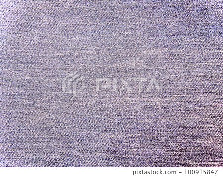 A background image of a bright, whitish violet plain denim fabric with a texture A background image of a bright, whitish violet plain denim fabric with a texture 100915847