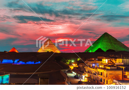 The Great Pyramid complex enlighted at night, Giza, Egypt 100916152