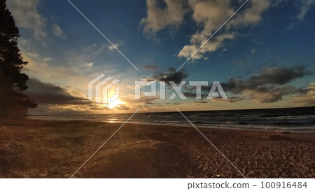 Beautiful sunset photo of Jurmala sea, sunset clouds, beach Beautiful sunset photo of Jurmala sea, sunset clouds, beach 100916484