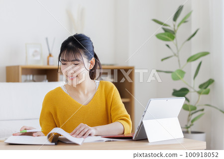 A young woman studying A young woman studying 100918052