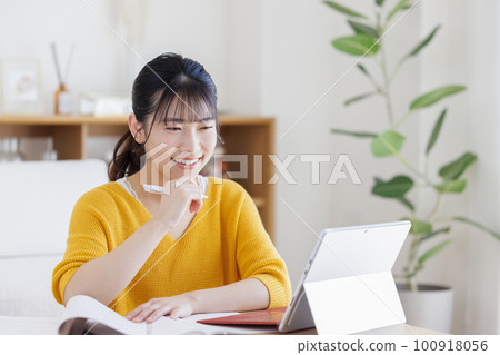 A young woman studying A young woman studying 100918056