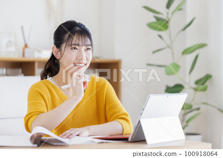 A young woman studying A young woman studying 100918064