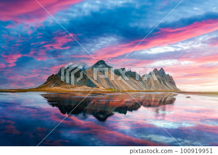 Famous Stokksnes mountains on Vestrahorn cape Famous Stokksnes mountains on Vestrahorn cape 100919951