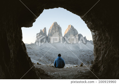 Lonely tourist at cave in mountain Lonely tourist at cave in mountain 100919960