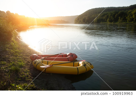 Orange and yellow packrafts rubber boats 100919963