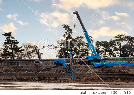 Blue crane working on the river bank Blue crane working on the river bank 100921510