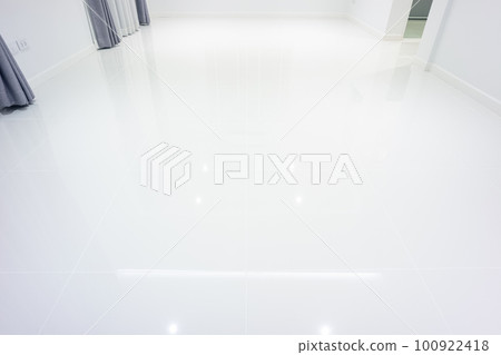 White tile floor in living room. White tile floor in living room. 100922418