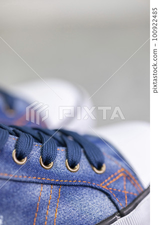 close up of denim sneakers close up of denim sneakers 100922485