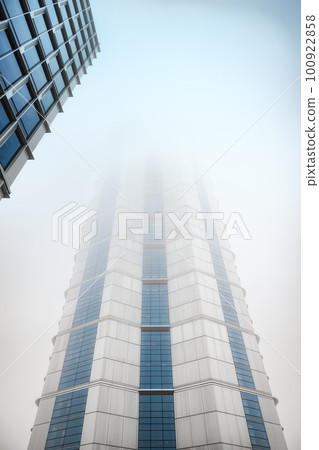 Glass building with cloudy sky angle shot 100922858