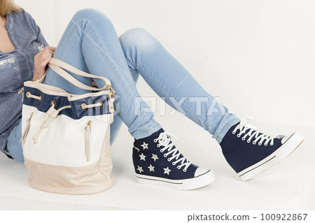 Young woman wearing fashionable shoes 100922867