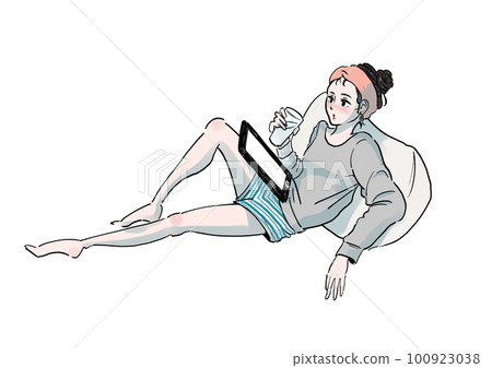 A woman relaxing by touching a tablet while drinking a drink in her room 100923038