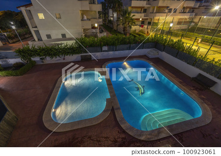 illuminated swimming pools at night 100923061