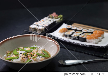 Various dishes of Asian cuisine with typical sushi 100923195