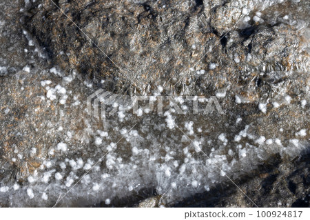 Salt sediment on a black rock, Fuertventura Salt sediment on a black rock, Fuertventura 100924817