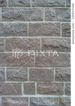 Cover page with modern granite stone wall with patterns of bricks and stones as a background, closeup, details. Cover page with modern granite stone wall with patterns of bricks and stones as a background, closeup, details. 100925589