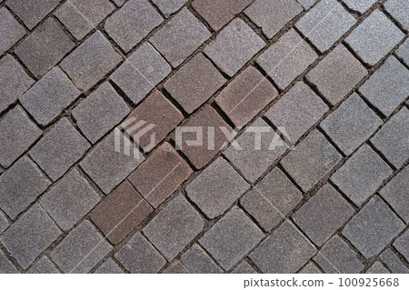 Pattern of ancient bricks and stones at old middle age pavement, as a background, closeup, details. Pattern of ancient bricks and stones at old middle age pavement, as a background, closeup, details. 100925668
