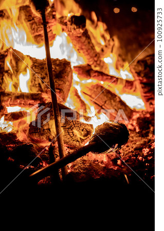Bonfire with sparks flying around. Fire and camping. Bonfire with sparks flying around. Fire and camping. 100925733