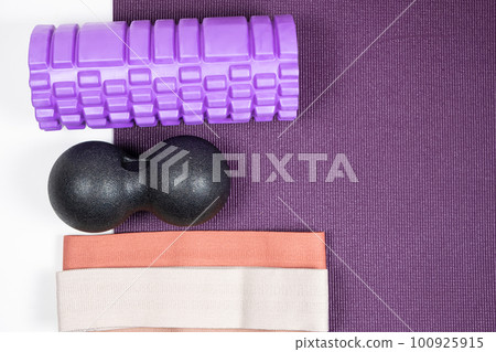 Sports equipment - massage roller, back ball and fabric fitness bands. Sports equipment - massage roller, back ball and fabric fitness bands. 100925915