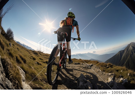 Professional cyclist in protective helmet trains on mountain road. Female athlete trains on a bicycle. Created with Generative AI 100926046