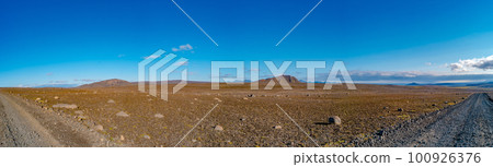 Panoramic over Icelandic Moon Lunar landscape near colorful volcanic caldera Askja, in the middle of volcanic desert in Highlands, blue sky, Iceland, lonely dirt road Panoramic over Icelandic Moon Lunar landscape near colorful volcanic caldera Askja, in the middle of volcanic desert in Highlands, blue sky, Iceland, lonely dirt road 100926376
