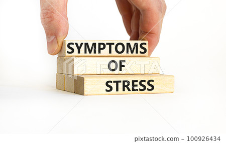 Symptoms of stress symbol. Concept words Symptoms of stress on wooden blocks. Beautiful white table white background. Doctor hand. Psychological business and Symptoms of stress concept. Copy space. Symptoms of stress symbol. Concept words Symptoms of stress on wooden blocks. Beautiful white table white background. Doctor hand. Psychological business and Symptoms of stress concept. Copy space. 100926434