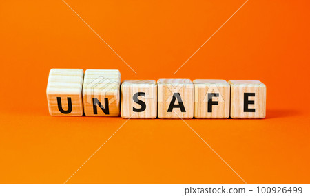 Safe or unsafe symbol. Concept word Safe Unsafe on wooden cubes. Beautiful orange table orange background. Business safe or unsafe concept. Copy space. Safe or unsafe symbol. Concept word Safe Unsafe on wooden cubes. Beautiful orange table orange background. Business safe or unsafe concept. Copy space. 100926499