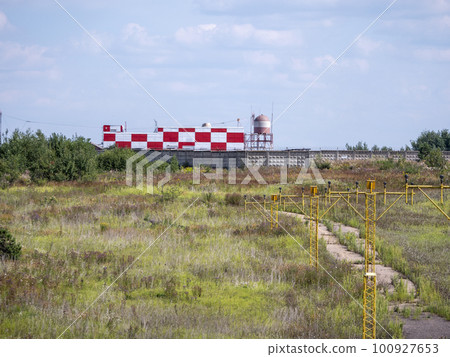 Yellow metal support systems of care during takeoff and landing direction light near runway 100927653